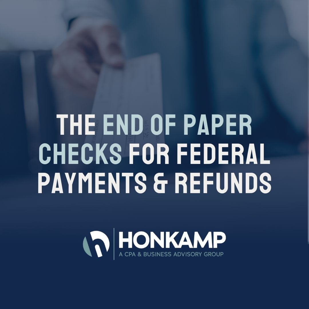 Overtop an image of someone holding a paycheck towards the camera, text reads 